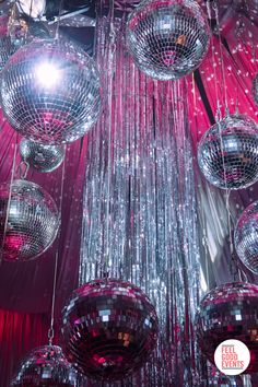 hanging silver mirror balls surrounded by vibrant pink lighting and silver drape at a pink and silver disco themed dinner party Hot Pink Disco Birthday Party, Disco Pink Birthday Party, Red Disco Party, Sparkly Party Theme, Disco Formal Theme, Disco Quinceanera, Disco Theme Decor, Retro Party Aesthetic, Party Decor Themes