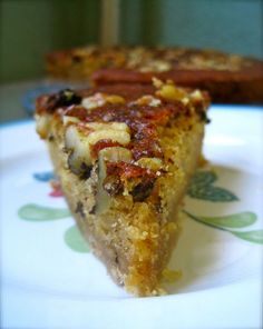 a slice of pizza sitting on top of a white plate