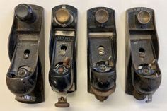 three old style sewing machines sitting next to each other