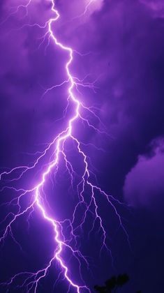 purple lightning strikes in the night sky