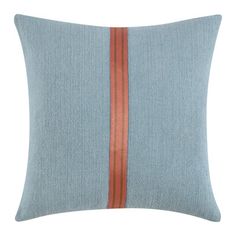 a light blue pillow with orange stripes on the front and back, against a white background