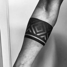 a man's arm with a tattoo on it and an arrow in the middle