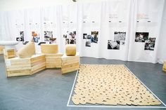 several pieces of wood stacked on top of each other in front of a white wall