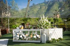 an outdoor wedding setup with flowers and decorations