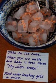 a bowl filled with ice cubes next to a sign that reads, ice baby