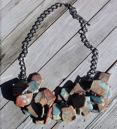 Light blue and brown African opal aqua terra jasper / varcasite stone cluster necklace with czech glass accents on a silver heavy chain. My jewelry is unique and handmade, so no two pieces will ever be exactly the same. Real colors may slightly differ from their appearance on your display, as it depends on your monitor settings and how your screen colors are calibrated. Turquoise Jasper For Jewelry Making, Turquoise Jasper Jewelry For Jewelry Making, Turquoise Jasper Jewelry With Natural Stones, Unique Turquoise Jasper Jewelry, Aqua Terra, Heavy Chain, Bib Necklaces, Cluster Necklace, Blue And Brown