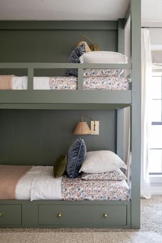 bunk beds with pillows on them in a bedroom