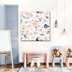 a child's room with two chairs and a table in front of the wall