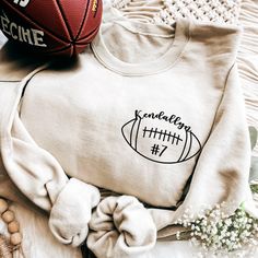 Football Sweatshirt, Sports Hoodie, Custom Football Embroidered Hoodie, Player Number Sweatshirt, Football Shirt, Football Season Shirt, Sports Shirt, College Football Shirt 🎀 This personalized embroidered crew neck sweatshirt can be exclusively customized with your university's name and surrounded by small patterns carefully designed by our designers. 🎀 This college sweatshirt is perfect for high school or college students as a promotion gift or graduation gift. This oversized sweatshirt is both casual and designer. The overall sweatshirt is made of cotton and polyester, soft and comfortable, suitable for year-round wear. 🎀 You can also order this sweatshirt as a college uniform or college apparel. The team is pretty speedy so no matter how busy we get we'll make sure your order is rea Boutique Football Shirts, Football Hoodies Designs, High School Football Shirts Design, Cricut Football Shirts Design, Football Sweatshirt Designs, Diy Football Shirts, School Football Shirts, High School Football Shirts, Basketball Shirt Designs