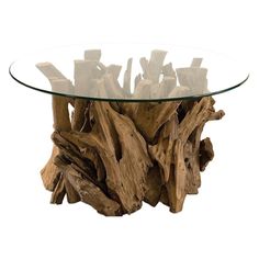 a glass table with driftwood pieces on the top and bottom, in front of a white background