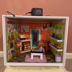 a doll house with furniture and accessories in it