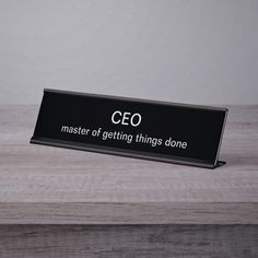 a black sign that says,'the master of getting things done'on it