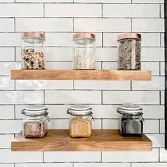 the shelves are filled with different types of spices