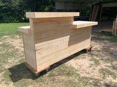 a wooden bar sitting in the middle of a field