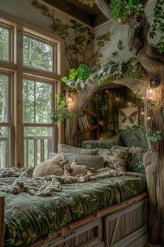 a dog laying on top of a bed next to a large tree in front of a window