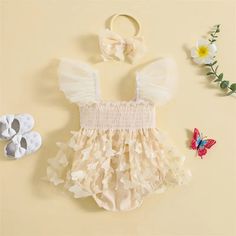 Dress your little princess in the enchanting charm of our Butterfly Romper Dress with Headband. This exquisite ensemble is designed with infant girls in mind, combining the ease of a romper with the elegance of a dress. Adorned with delicate butterfly decorations, fly sleeves, and a ruched mesh skirt hem, this jumpsuit is a dream come true for your newborn. Not just a piece of clothing, but a complete outfit with a matching headband, it promises to make your baby girl the center of attention at any gathering.Each romper dress is embellished with butterfly decorations, adding a whimsical and charming touch that celebrates the beauty and freedom of these enchanting creatures.The romper features airy fly sleeves, adding a soft, ethereal quality to the outfit and ensuring your baby stays comfo Tulle Tutu Dress, Infant Baby Girl, Sweet Clothes, Delicate Butterfly, Butterfly Decor, Tulle Tutu, Jumpsuit Party