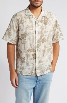 Ready for your packing list, this cotton shirt features a muted print of swaying palms and fresh flowers. 27 1/4" length; 42" chest length (size Medium) Front button closure Notched collar Short sleeves 100% cotton Machine wash, line dry Imported Cotton Hawaiian Shirt With Palm Tree Print, Cotton Camp Shirt With Palm Tree Print, Cotton Camp Shirt With Palm Tree Print, Relaxed Fit, Relaxed Fit Cotton Camp Shirt With Palm Tree Print, Cotton Palm Tree Print Top With Camp Collar, Cotton Top With Palm Tree Print And Camp Collar, Cotton Camp Collar Top With Palm Tree Print, Camp Shirt With Floral Print And Relaxed Fit, Short Sleeve Linen Shirt With Floral Print