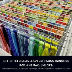 an assortment of acrylic floss hangers for sale in a store with the words get 25 clear acrylic floss hangers for 47 pm colors