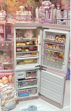 an open refrigerator filled with lots of toys