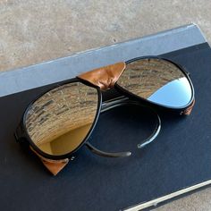 Up For Grabs Is A Pair Of Vintage Ray-Ban Bausch & Lomb Sunglasses. These Sunglasses Have A Black Pilot-Style Frame Made Of Nylon And Silver Lenses. They Were Made In France In The 1980s And Are In Good Vintage Condition. The Sunglasses Have A Classic Aviator Look And Are Suitable For Everyday Use. These Sunglasses Are A Great Vintage Accessory And A Must-Have For Any Collector Ski Logo, Vintage Ray Ban, Pilot Style, Man Ray, Logo Color, Vintage Accessories, Ray Ban, Made In France, Sunglasses Accessories