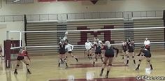 the girls are playing volleyball on the court