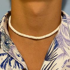 Experience the exotic beauty of the Elios White Shell Puka style Men Necklace! Made in the USA. This 14Kt gold-filled necklace is 16-17" long and sure to bring you seaside vibes wherever you are. A stylish addition to any look, its perfect for a beach day or a casual evening. Live seaside living with this unique statement piece! Puka Shell Necklace Men, Adjustable Single Strand Jewelry For Vacation, Single Strand Choker Necklace For Beach, Adjustable Single Strand Necklace For Vacation, Minimalist Beach Choker Jewelry, White Single Strand Necklace For Beach, Minimalist Adjustable Necklaces For Beach, Seashell Necklace Diy, Puka Shell Necklace