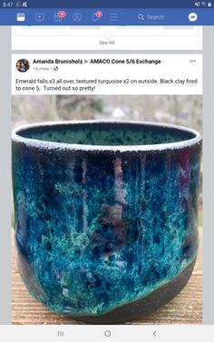 a blue bowl sitting on top of a wooden table