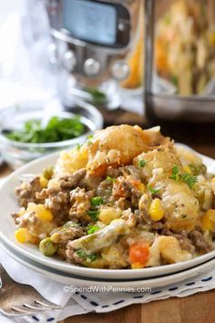 a close up of a plate of food on a table with an instant pressure cooker in the background