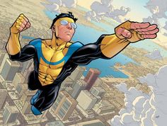 a man flying through the air while wearing a yellow and black suit with blue accents