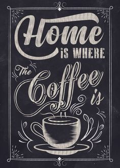 a chalkboard sign with the words home is where coffee is written in white ink