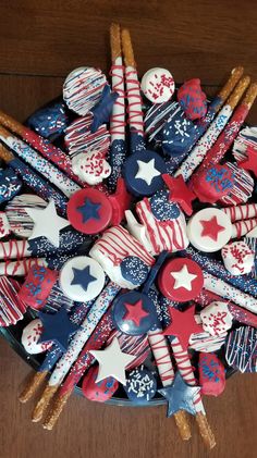 a bowl filled with red, white and blue cookies