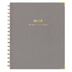 a gray and yellow notebook with the year 2013 - 2016 written in gold on it