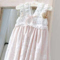 Handmade in the USA Our timeless and classic rose and vine embroidered cotton lace is back featured in a new baptism style! The blush lining is made with very soft supima cotton, and the ivory cotton lace overlay has vintage inspired embroidery with rose and vine designs. This is made to fall a few inches past baby’s feet so it’s a gown length without overwhelming your little girl. The bodice is made with a soft stretch lace that creates an easy and comfortable fit for your little one, with a bl Lace Bonnet, Christening Gown, Heirloom Gifts, Baby Bonnets, Christening Gowns, Vine Design, Create Outfits, Supima Cotton, Stretch Lace