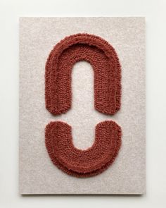 the letter c is made out of yarn