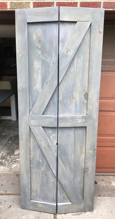 an old door is painted white and has been made to look like a barn door