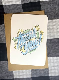 a card with the words thank you on it