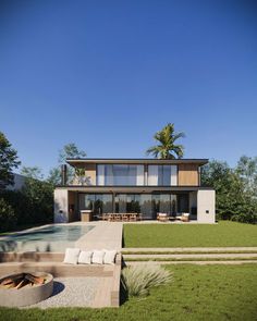 a modern house with an outdoor fire pit