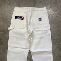 excellent vintage condition. appear unworn. light stain on back.  waist will probably shrink a bit in wash. please refer to approximate measurements (flat) below - may not fit as tagged waist - 35" inseam - 29.5" if you have any questions, please ask. White Cotton Work Pants With Cargo Pockets, Retro White Bottoms With Pockets, White Retro Bottoms With Pockets, White Retro Pants For Streetwear, White 90s Style Cotton Pants, White Cotton 90s Style Pants, Vintage White Bottoms With Pockets, Retro White Pants With Pockets, White Vintage Bottoms With Pockets