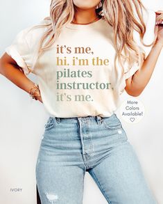 a woman in ripped jeans and a t - shirt that says it's me, hit i'm the pilates instructor, it's me