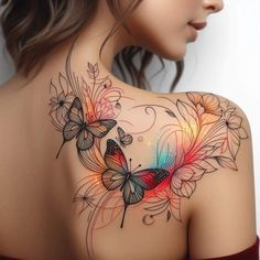 the back of a woman's shoulder with butterflies and flowers painted on her body