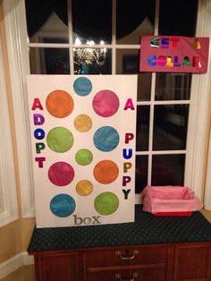 a child's room decorated with colorful polka dots and the words adopt puppy box