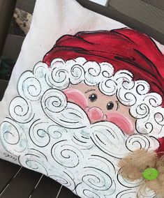 a decorative pillow with a santa clause on it