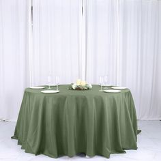 the table is set with two wine glasses on it