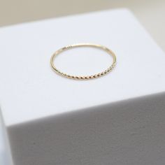 our Tiny Dancer Ring is as much of a classic as the beloved song it is named after. an ideal choice for minimalists or active lifestyles, you can't go wrong with this effortless band. ideal for stacking and a staple in curating your capsule jewelry collection. fine 14k solid gold .49 grams .9mm thick Adjustable 14k Gold Midi Rings For Everyday, Adjustable Stackable Rings For Everyday Fine Jewelry, Adjustable Everyday Rings With Round Band, Adjustable 14k Gold Bands For Everyday, Adjustable Round Band Rings For Everyday Wear, Everyday Adjustable Round Band Rings, Adjustable Yellow Gold Rings For Everyday Use, Everyday Simple Stackable Rings In Recycled Gold, Double Band Stackable Everyday Bands