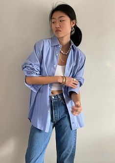 Soft 100% cotton menswear shirt featuring baby blue and white luxe woven fabric and spread collar.    bust 46  hips 46. length front 30 back 32  shoulder 18  sleeve 24    oversized fit. model is 5'10 size 2