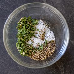 the ingredients are mixed together in a bowl on the counter top, including spices and seasonings