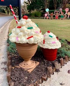 two ice cream sundaes sitting on top of a flower pot