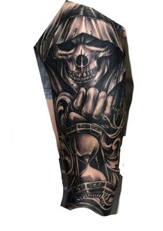 a man's arm with a black and grey tattoo on it, depicting a skull holding