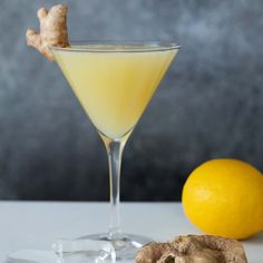 a lemon and ginger cocktail with a ginger garnish