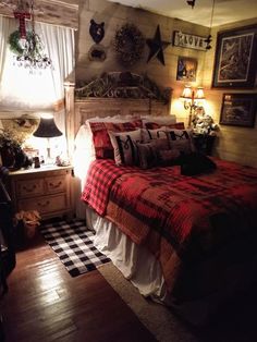 a bed room with a neatly made bed and two lamps on either side of the bed